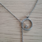Lariat necklace with thin chain and circular motif used