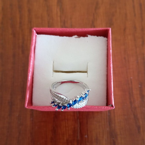 Ring new, gold plated with blue and silver zircon stones, size 7