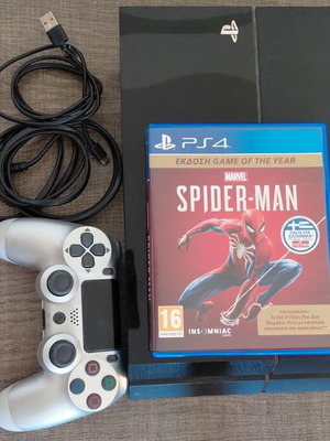 PlayStation 4 console used with Spider-Man game and controller