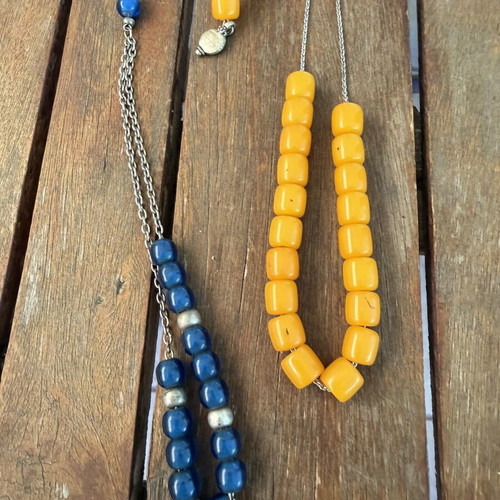 Set of two komboloi like new, one yellow and one blue