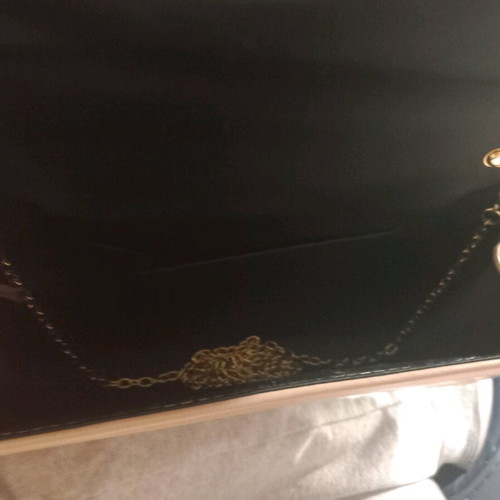 Pink clutch used with chain and slight wear