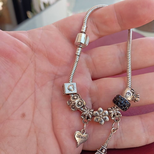 Steel bracelet with removable charms like new