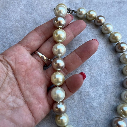 Necklace with large beads in white, gold and bronze shades like new