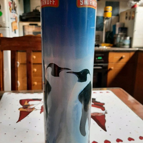 Smirnoff collectible tin and Ursus Rotter red bottle used
