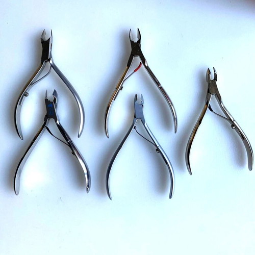 Manicure and cuticle nippers used, various models including Credo Solingen