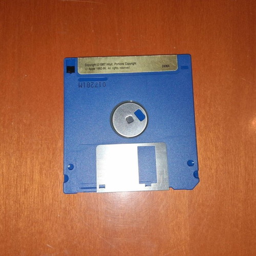Quicken Program Disk and User's Manual used for Apple IIGS, IIc, IIc Plus, IIe