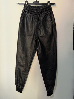 Women's black leather balloon or jogger pants used, with elastic waist and cuffs