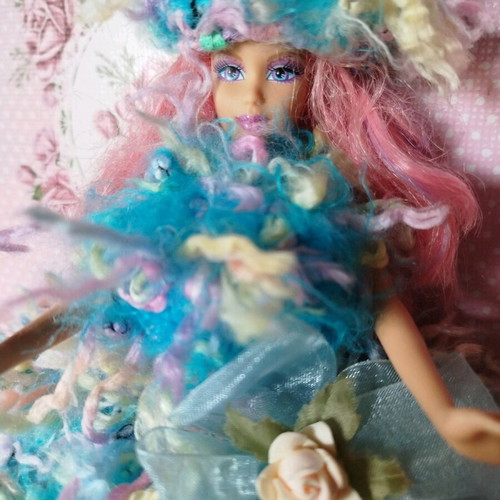 Doll with handmade dress and hat used