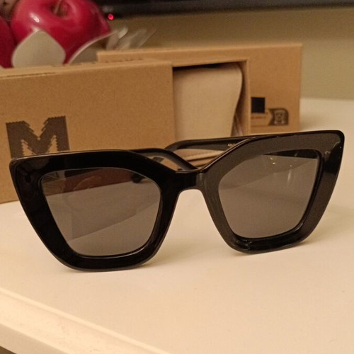 Meller Azalee sunglasses new with black polarized lenses