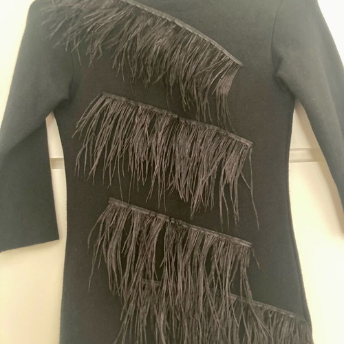 Zini black turtleneck like new, size small, with feathers and back opening