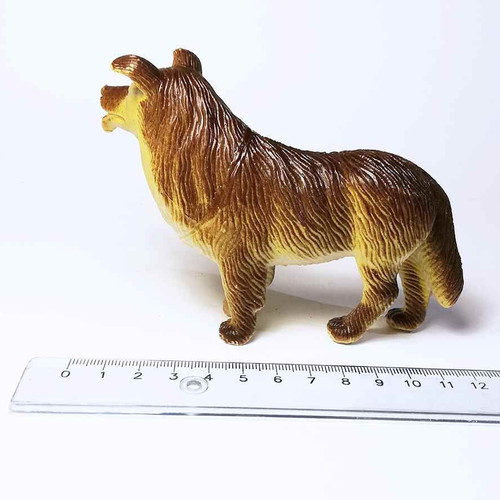 Dog plastic figure used with scratches and marks