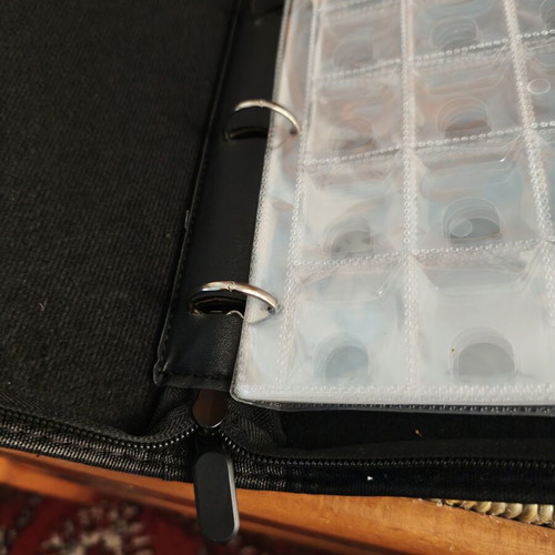 Coin album with 200 slots, zipper closure, strap