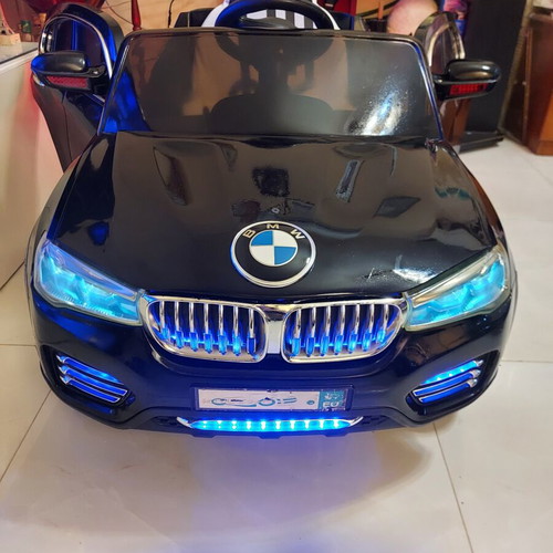 BMW X6 electric ride-on car like new with remote control and LED lights