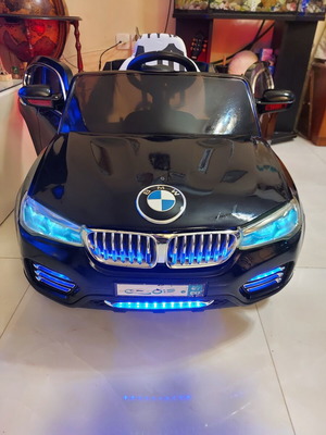 BMW X6 electric ride-on car like new with remote control and LED lights