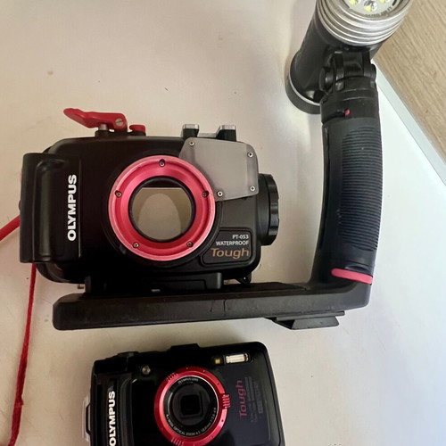 Olympus Tough GPS Camera like new with housing, torch, and base