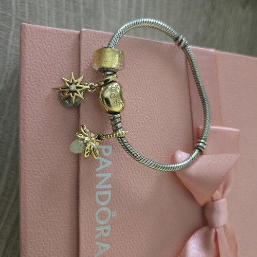 Pandora authentic bracelet like new with 3 gift charms silver and gold