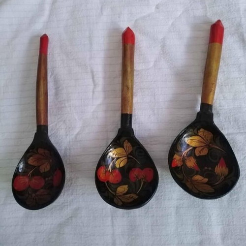 Set of three handmade wooden Russian spoons used, hand-painted