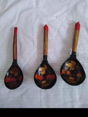 Set of three handmade wooden Russian spoons used, hand-painted