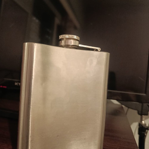 Vintage flask with pin-up design used, stainless steel