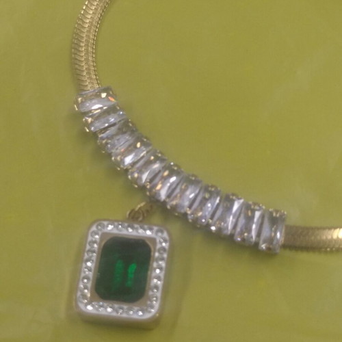 Jewelry set made of steel new with green and gold stones