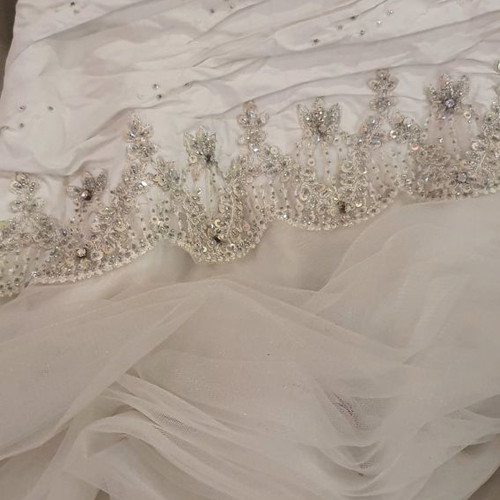 Wedding dress new, designer piece from London in ice color with embroidery