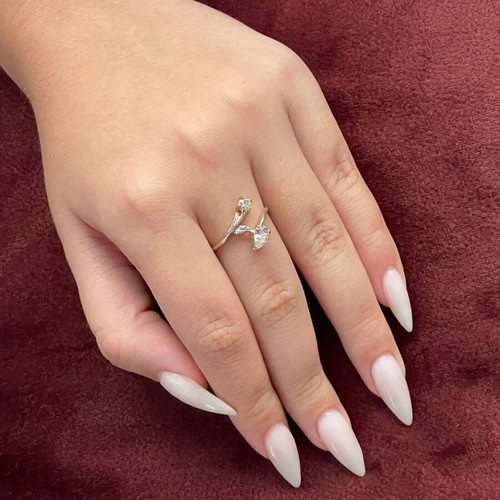Women's 14K gold ring like new with round cut and pear-shape stones