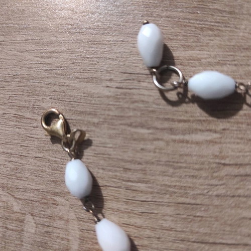 Silver bracelet new with white beads and metal detail