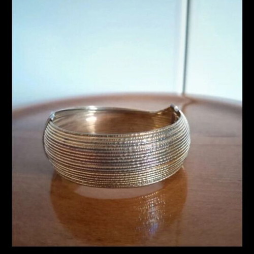 Faux Bijou gold bracelet like new with fixed bone style