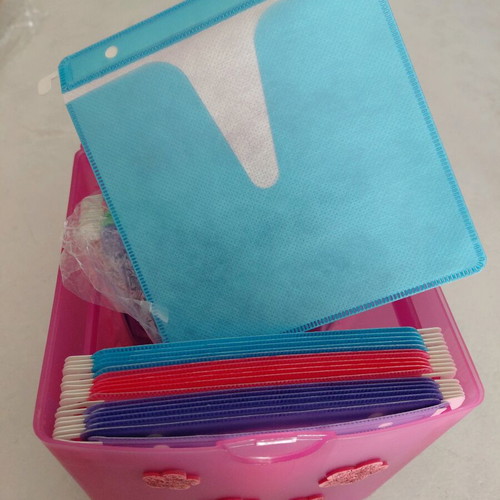 CD storage box with colorful sleeves like new