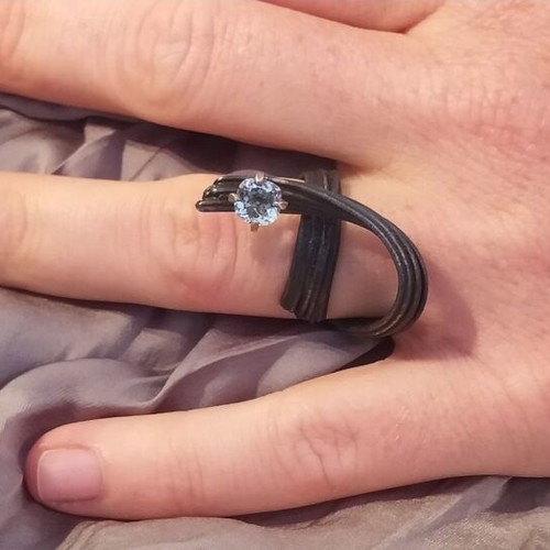 Handmade ring of oxidized silver with white topaz like new