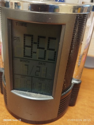 Pen holder with built-in electronic clock used
