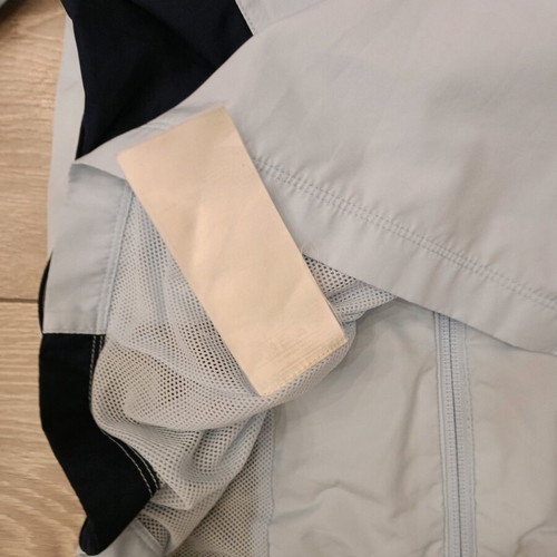 Vintage Nike windbreaker jacket used in ice blue with dark navy details