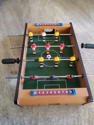 Wooden foosball table used with 1 ball, missing two plastic handles