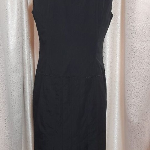 VS black sleeveless dress with round neckline and pleats, size 50