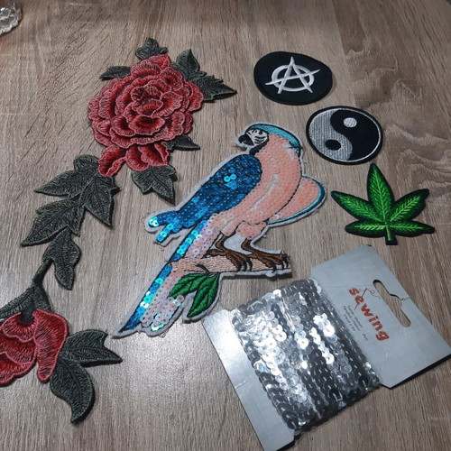Iron-on patches for garments used with sequins and embroidery designs