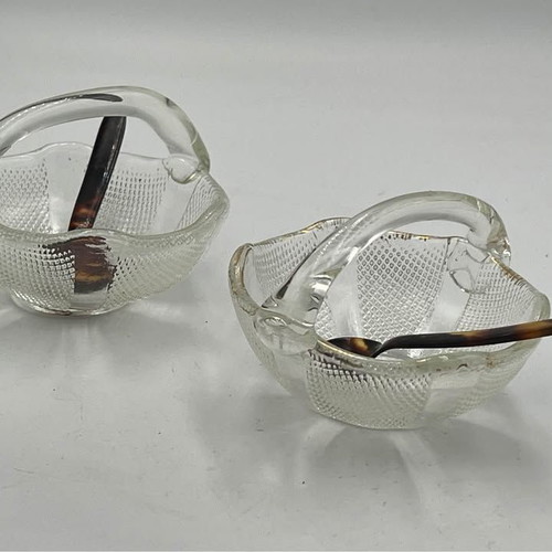 Two small glass baskets with spoon for caviar used