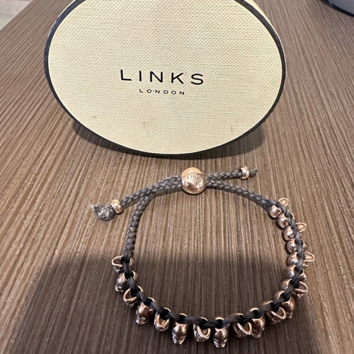 Links Of London collectible bracelet like new, rose gold and black cord