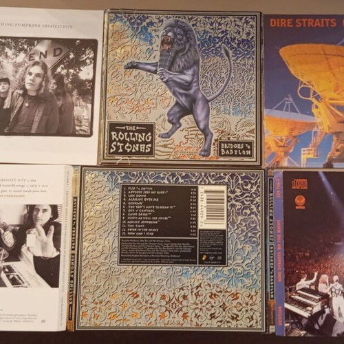 Booklets from Smashing Pumpkins, Rolling Stones, Dire Straits used, rock