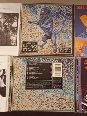 Booklets from Smashing Pumpkins, Rolling Stones, Dire Straits used, rock