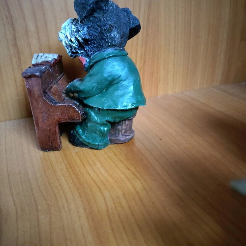 Decorative dog figure with piano like new
