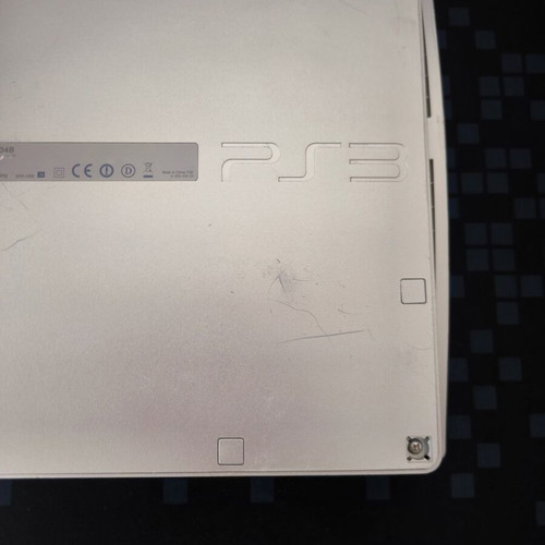 Sony PlayStation 3 Slim Satin Silver 320GB console with original DualShock 3 used