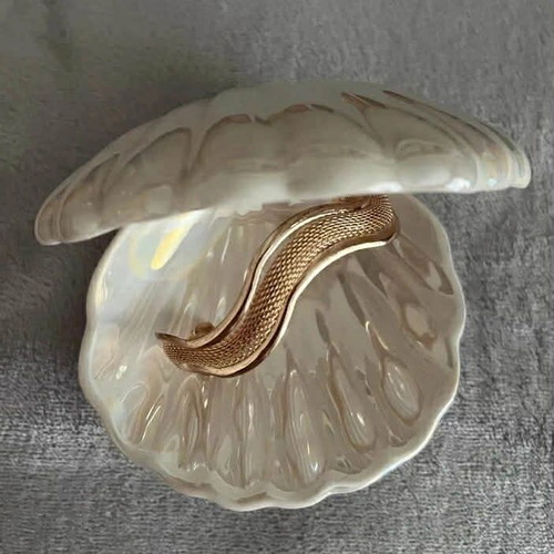 Bracelet new with wavy design in rose gold tone