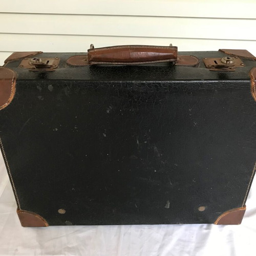 Small antique suitcase used with wear