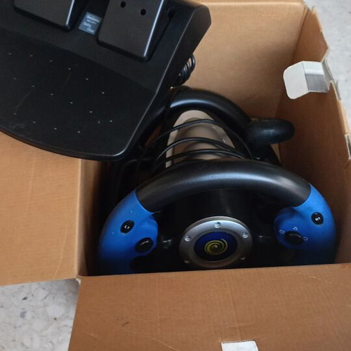 Steering wheel for PlayStation 2 used with signs of wear