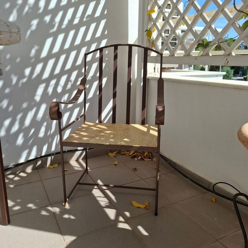 Retro wrought iron garden armchair with cushions used