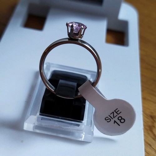 Stainless steel solitaire ring new with purple stone, size 18