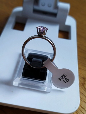 Stainless steel solitaire ring new with purple stone, size 18