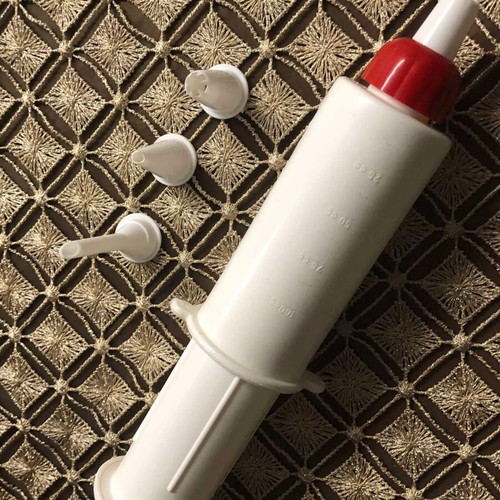 Pastry piping syringe new with 4 nozzles