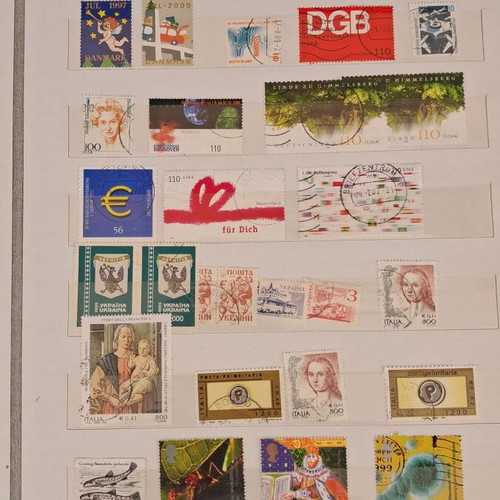Stamp album used with 10 pages of foreign stamps 1960-1990