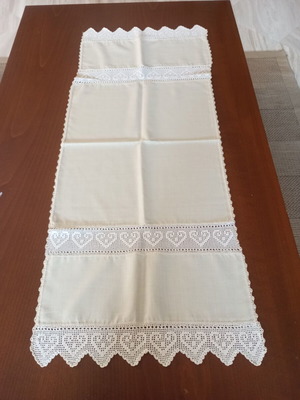Beige hand-embroidered table runner with heart details